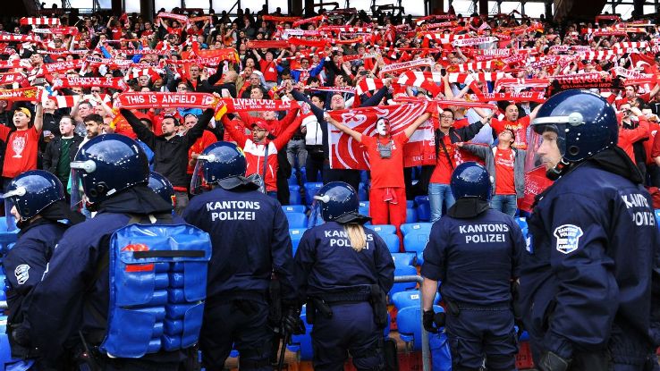   Seville police watch Liverpool fans during the Champions League clash in Seville 