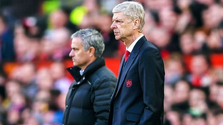 Arsene Wenger, fore, and Jose Mourinho look on during a match between Arsenal and Manchester United.