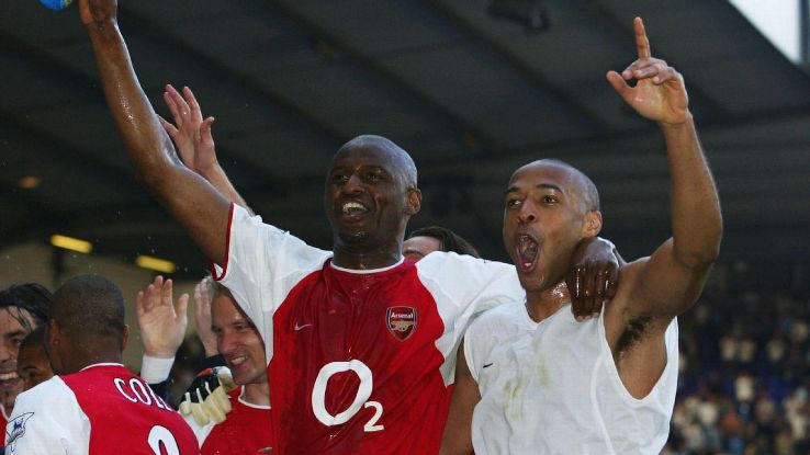 Patrick Vieira and Thierry Henry celebrate after Arsenal's Premier League match against Tottenham.
