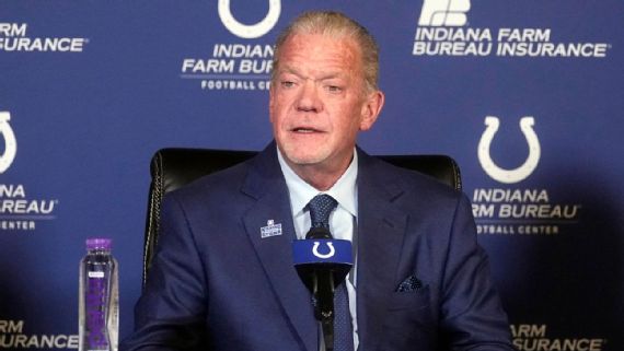 Jim Irsay holding the Lombardi Trophy