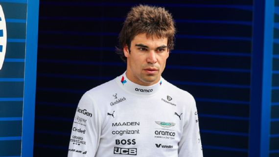 Lance Stroll ‍in his Aston Martin car during a practice session.