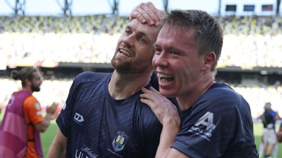 Christian Gray of Auckland City celebrates his goal against Boca Juniors.