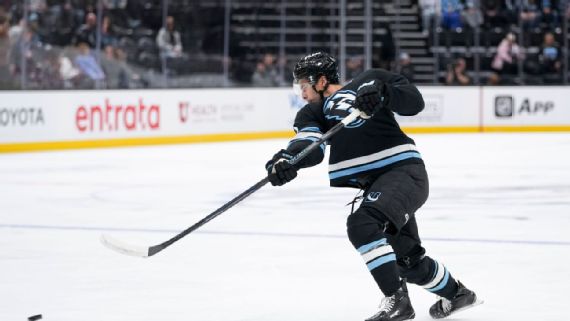 Dylan Guenther playing hockey