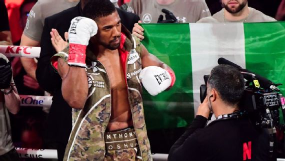 Anthony Joshua stood in front of the Nigeria flag ahead of his bout against Jake Paul at the Kaseya Center in Miami.