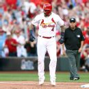St. Louis Cardinals' Yadier Molina performs throat-slashing gesture after  game-winner