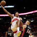 Heat's Caleb Martin tackles Raptors' Christian Koloko into stands