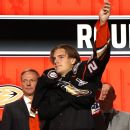 Matvei Michkov puts on a Philadelphia Flyers jersey after being picked by  the team during the first round of the NHL hockey draft Wednesday, June 28,  2023, in Nashville, Tenn. (AP Photo/George