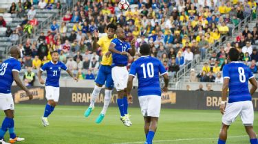 Male Professional Soccer Player Wearing A Brazil Yellow National Team Jersey  With The Number Ten On The Back Entering The Stadium Full Of Fans For A  Match. Stock Photo, Picture and Royalty