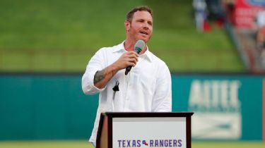 Texas Rangers Josh Hamilton gesters to the dugout after hitting a