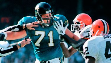 Former Jacksonville Jaguars offensive tackle Tony Boselli, center, stands  with members of his family after a ceremony, where he was presented with  his Pro Football Hall of Fame ring and had his