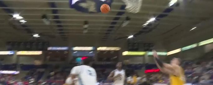 Jusaun Holt gets up for the beautiful dunk