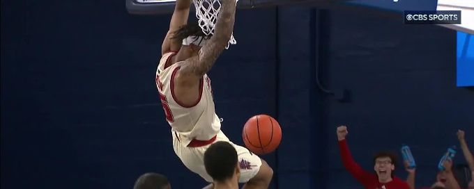Alijah Martin soars through he paint for an electric FAU alley-oop