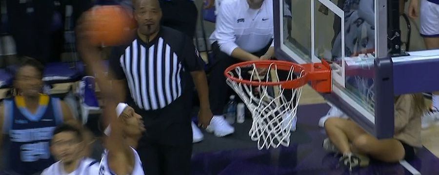 Xavier Cork jumps out of the gym for a TCU dunk