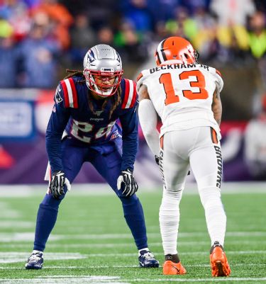 Tom Brady of the New England Patriots runs against Dre''Bly of the