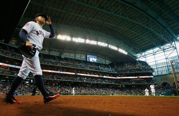 JUN 04 2015: Orbit, the Houston Astros' mascot, waves to the crowd prior to  the MLB baseball game between the Houston Astros and the Baltimore Orioles  from Minute Maid Park in Houston