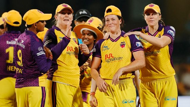 The UP Warriorz players congratulate Grace Harris for her hat-trick