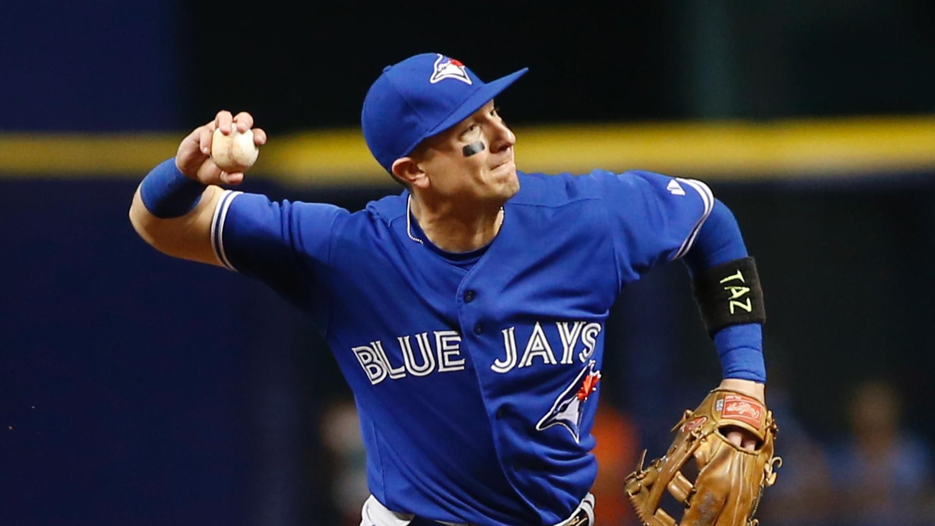 Troy Tulowitzki worked on his pitching mechanics during Blue Jays photo day