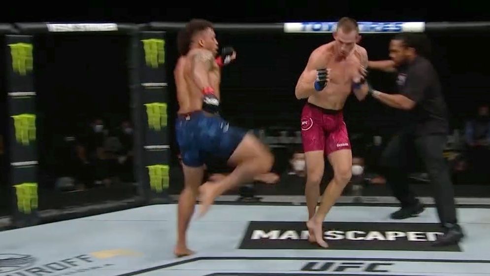 Ref Herb Dean has to evade leg kick ESPN Video