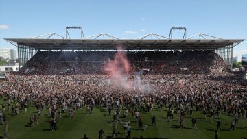 St. Pauli fans storm pitch after Bundesliga promotion confirmed