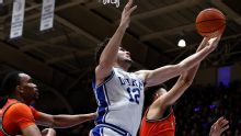 Evans, Boozer help No. 1 Duke beat No. 11 Virginia 77-51 to clinch ACC Tournament's top seed