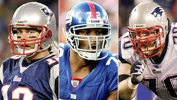 New England Patriots running back Kevin Faulk (33) starts up field behind  blockers Stephen Neal (61) and Dan Koppen (67) in the second quarter  against the New York Giants in Super Bowl