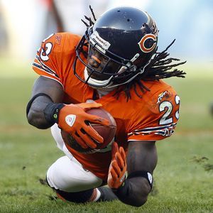 Chicago Bears wide receiver Bernard Berrian is hit by Dallas