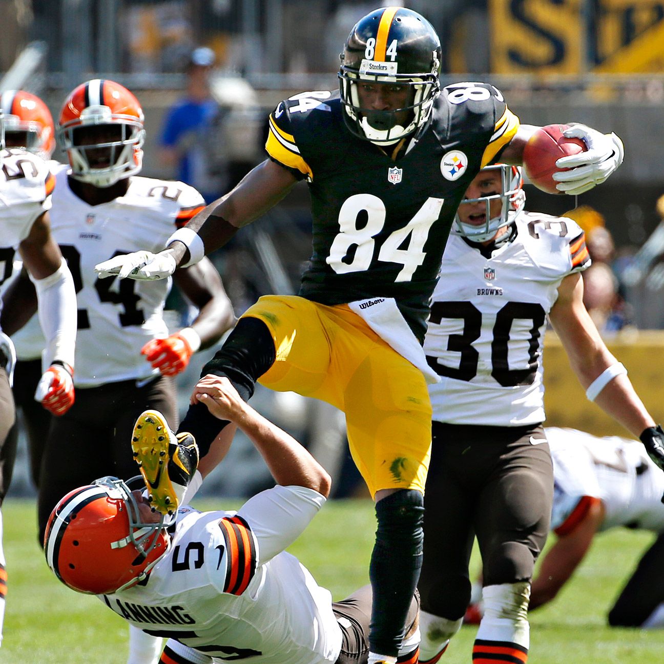 Pittsburgh Steelers wide receiver Antonio Brown (84) runs past Oakland  Raiders defenders after making a catch to help set up the Steelers game  winning field goal in the fourth quarter of an