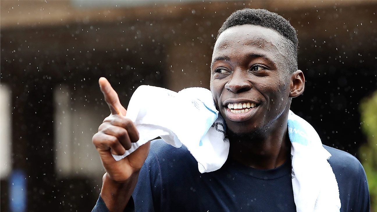 Amida Brimah finishes first in annual 'Husky Run'