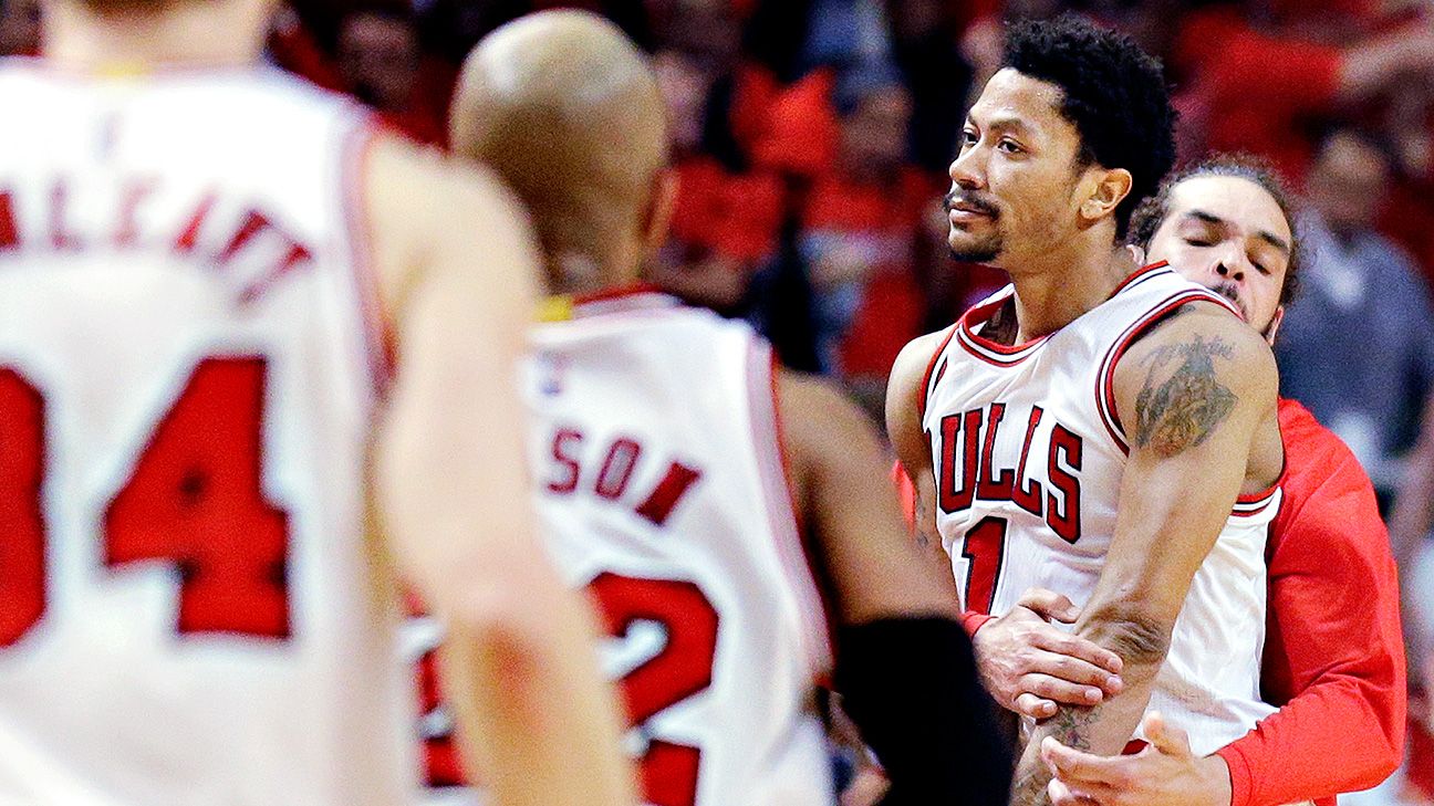 Derrick Rose of the Chicago Bulls lets out a scream after dunking