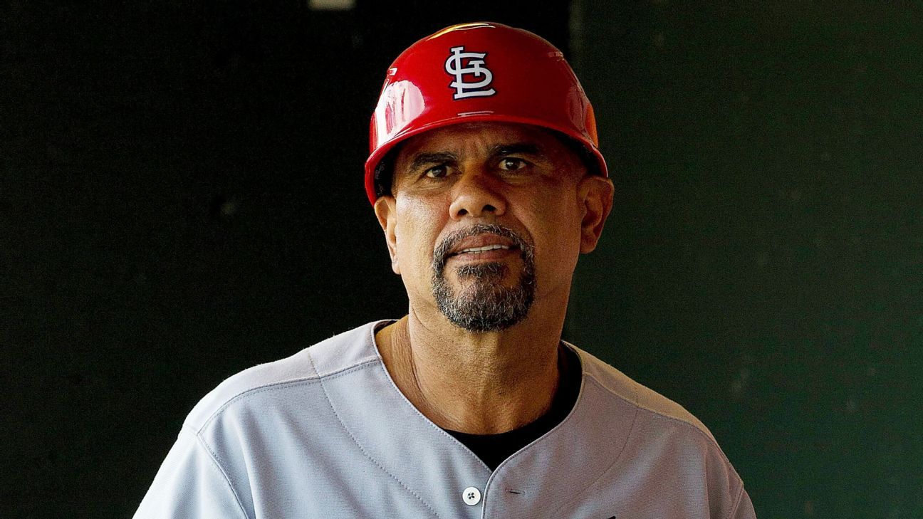 St. Louis Cardinals third base coach Jose Oquendo walks in the