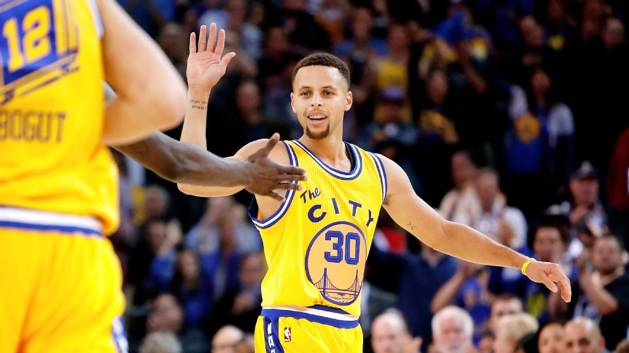 Golden State Warriors' Stephen Curry (30) wears The Town jersey