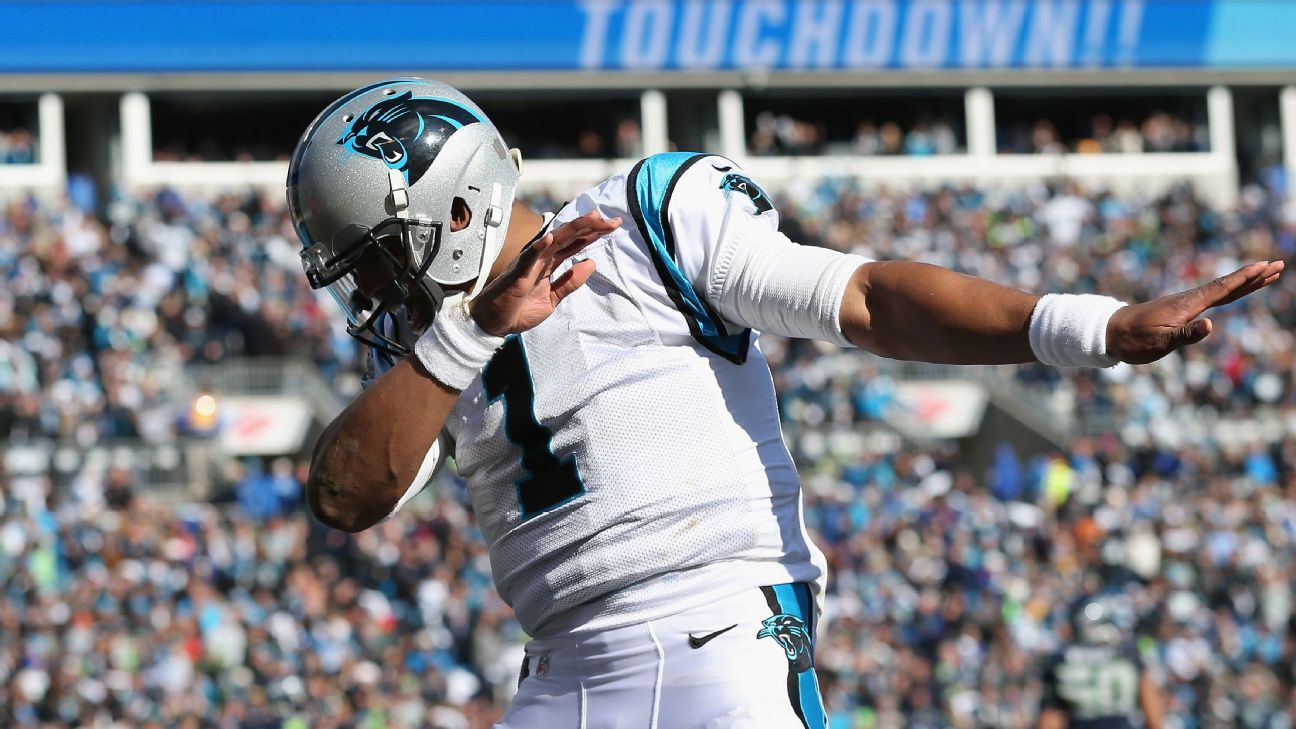 Carolina Panthers quarterback Cam Newton prays along the sideline