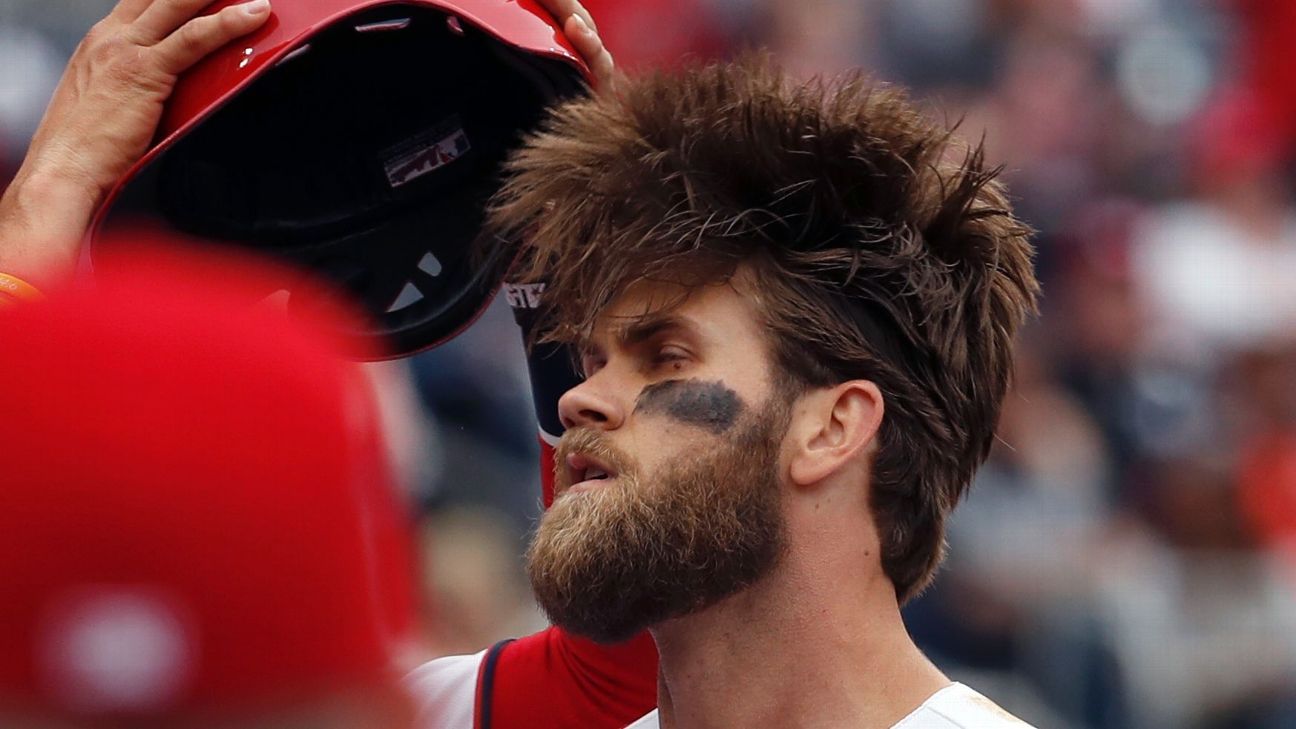 Dallas Keuchel of the Houston Astros tugs on his beard as he looks