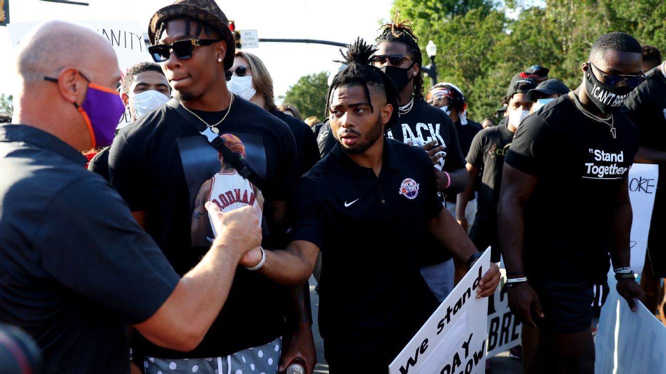 Clemson football players lead campus march in support of equality