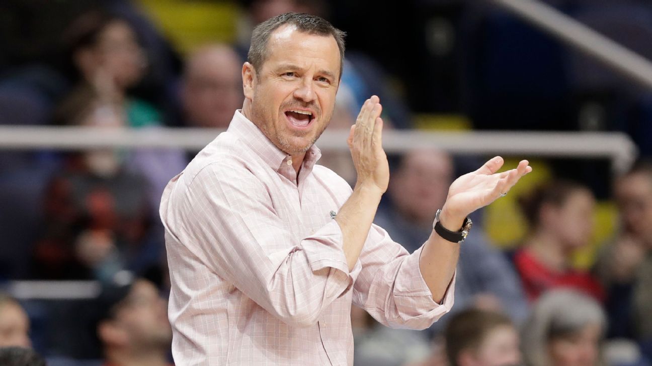Louisville women's basketball coach Jeff Walz installs slide from coaches' offices to the gym