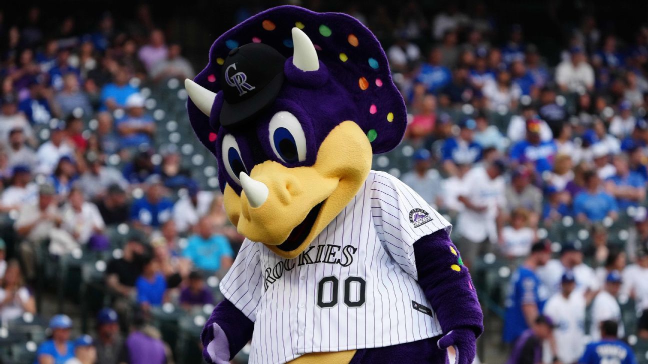 Colorado Rockies mascot dinger the dinosaur in the first inning of