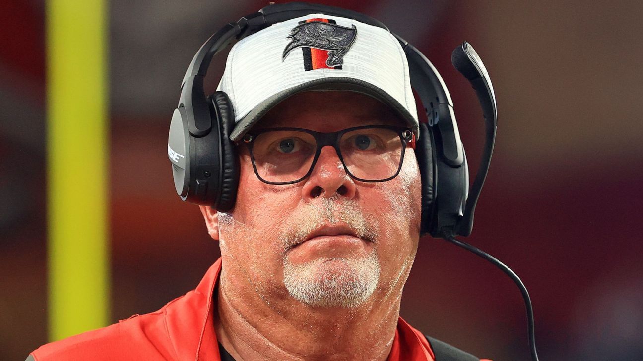 Bruce Arians looks like many things with face shield, headset and hat