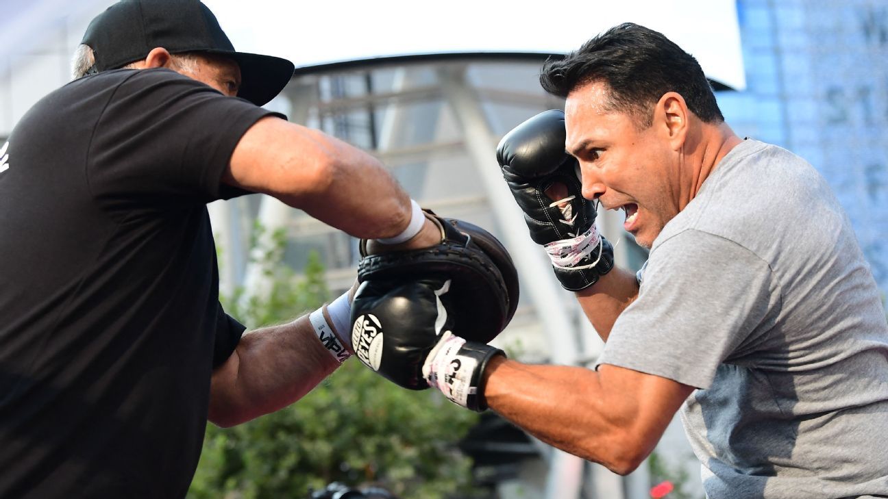 Oscar De La Hoya hospitalized with COVID-19; Vitor Belfort will now face Evander..