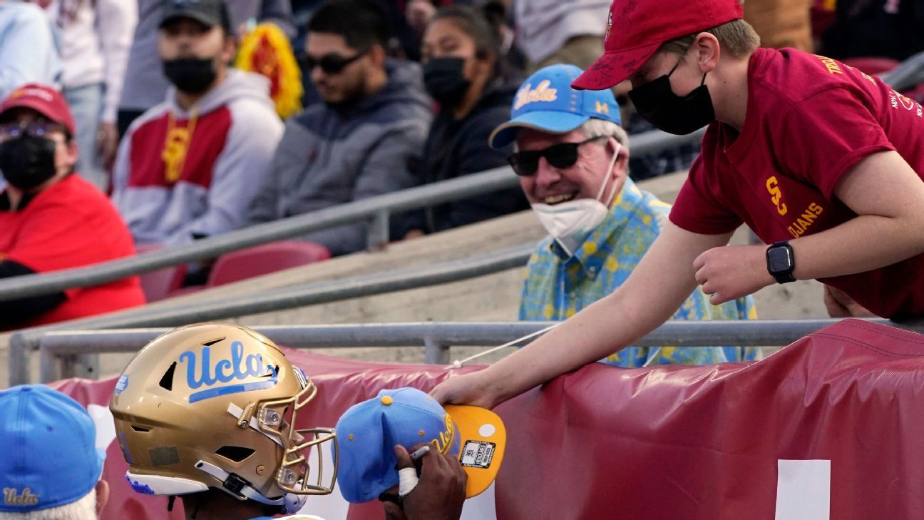 UCLA quarterback Dorian Thompson-Robinson signs hat after touchdown, flagged 15 ..
