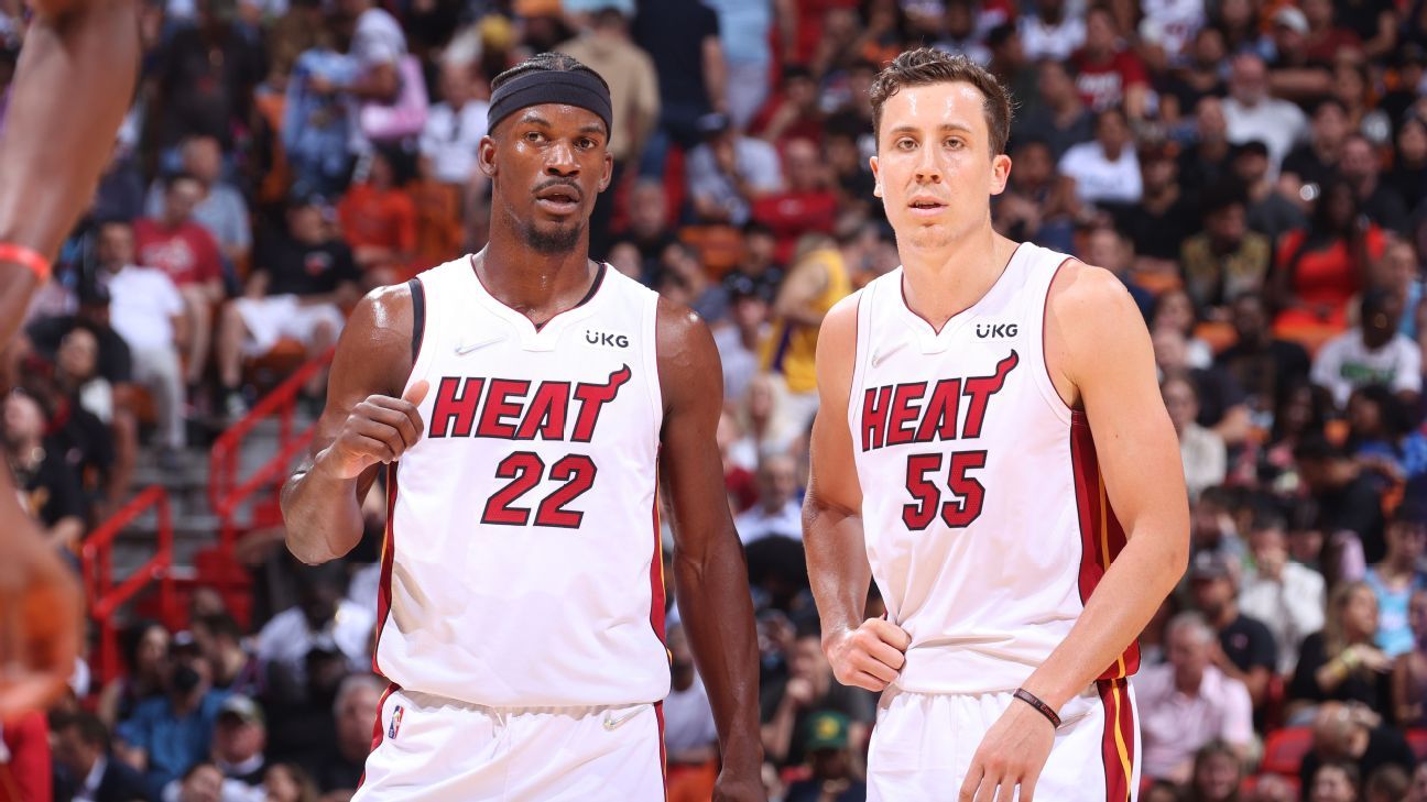 Tyler Herro wears beach outfit on bench during Game 5