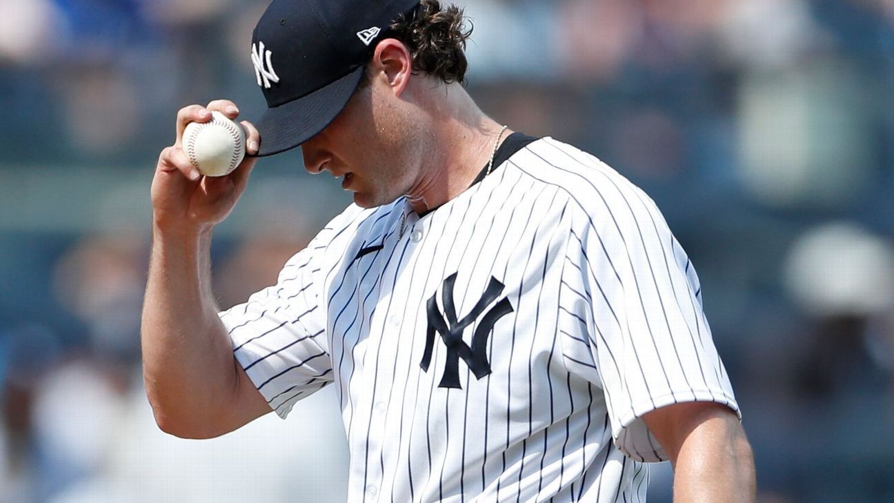 New York Yankees manager Aaron Boone (17) walks off the field after making  a pitching change in the ninth inning against the Cleveland Guardians in a  baseball game, Monday, May 1, 2023