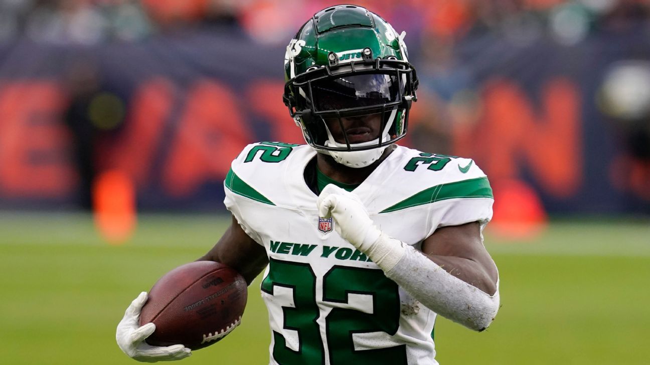 New York Jets running back Michael Carter (32) warms up before taking on  the Miami Dolphins during an NFL football game Sunday, Oct. 9, 2022, in  East Rutherford, N.J. (AP Photo/Adam Hunger