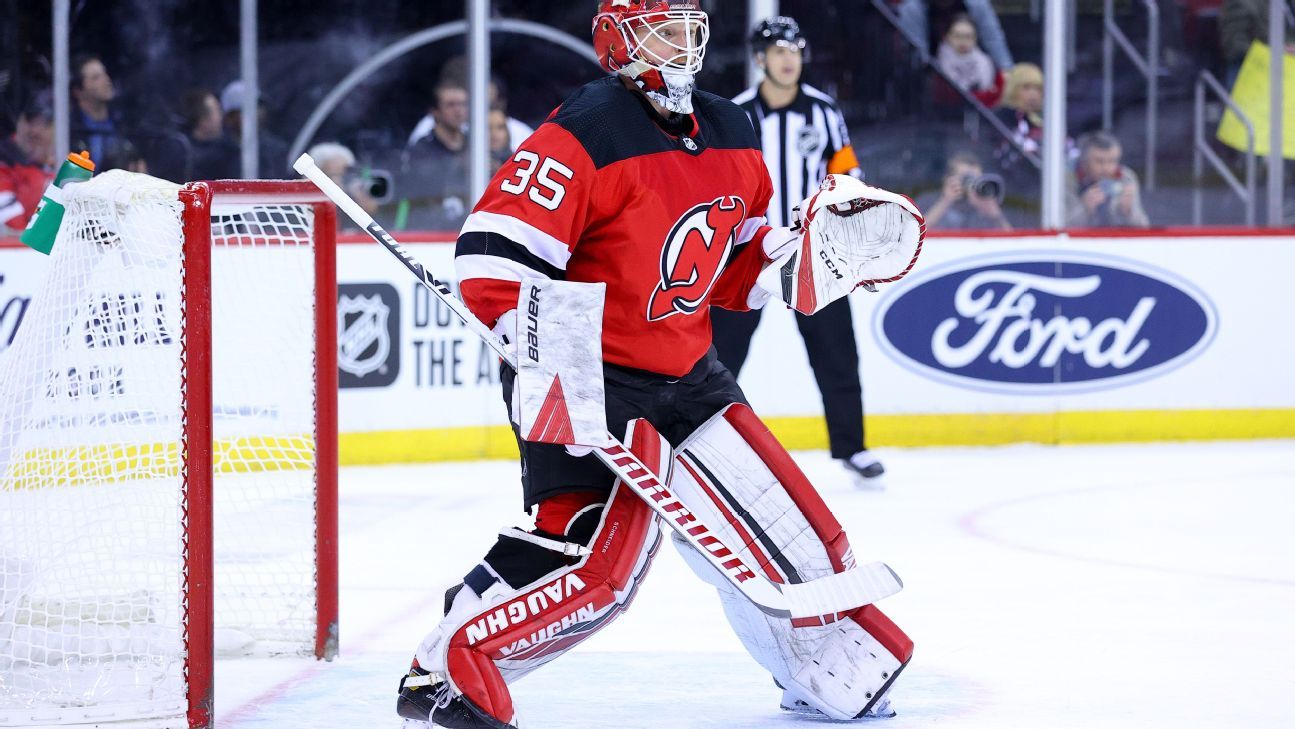 Devils goalie Cory Schneider leaves game; Jets rally to win