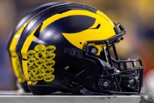 Michigan LB Jaishawn Barham flagged for head-butting official