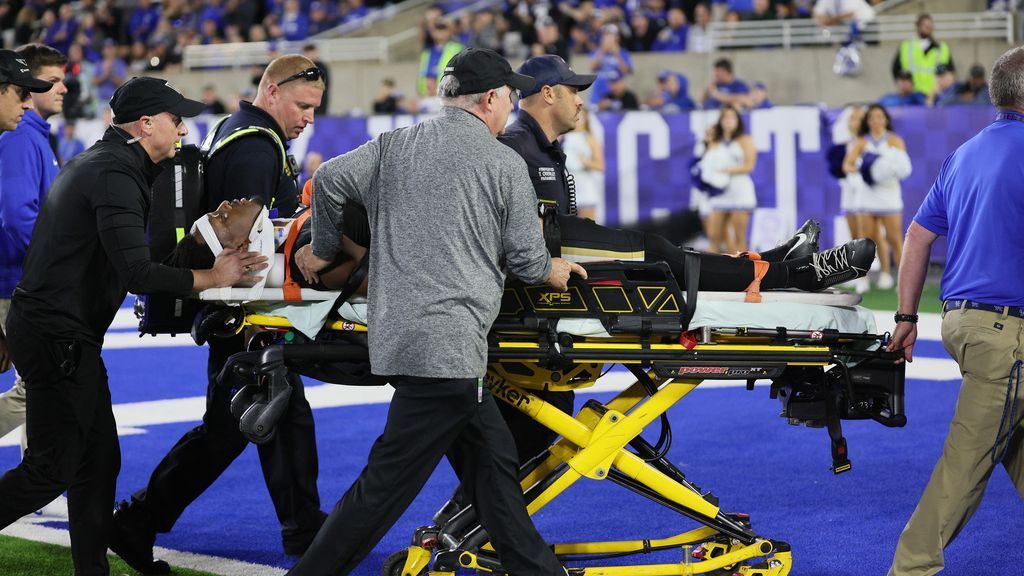 Vanderbilt’s Miles Capers stretches out and then returns to the sideline