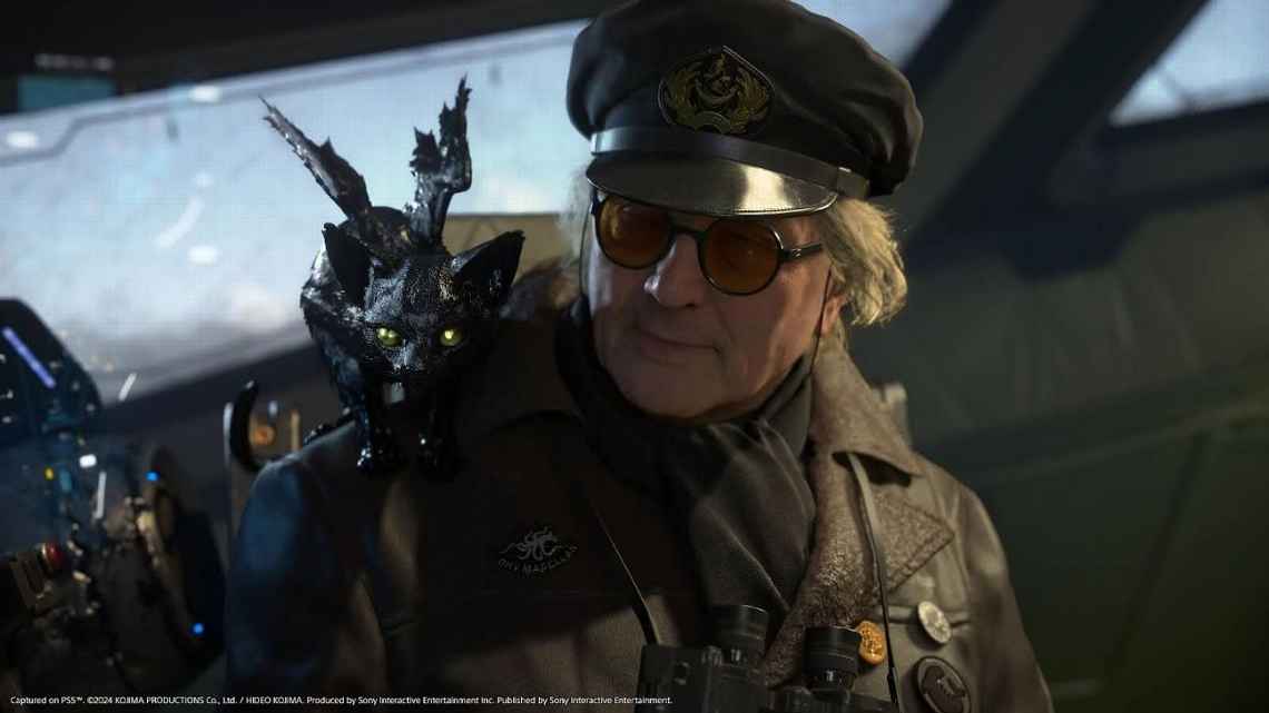 Gameplay screenshot showing a character cameo (George Miller) in Death Stranding 2.