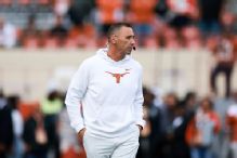 Sarkisian says comms could be cut with Trump attending game