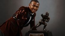 Who has won the Heisman and a championship in one season?