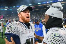 Darnold shows grit as Seahawks rally, clinch postseason berth