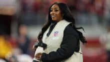 Simone Biles serves as credentialed photographer at Bears-49ers